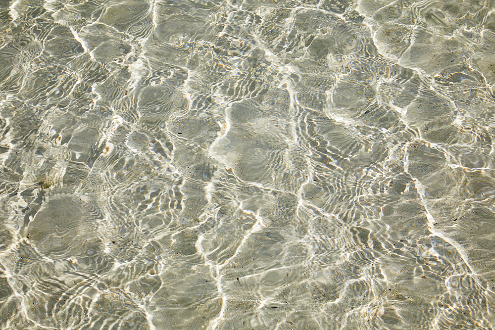 Sparkling shallows over a sandy seabed, in a shallow lagoon close to the shore of Havodda Island; Gaafu Dhaalu atoll, Maldives