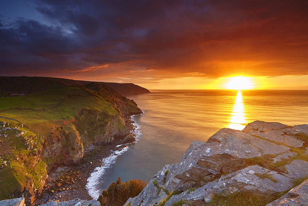 Sunset over coastal cliffs seen from the Valley of Rocks, Lynton, Exmoor National Park, Devon, England, United Kingdom, Europe