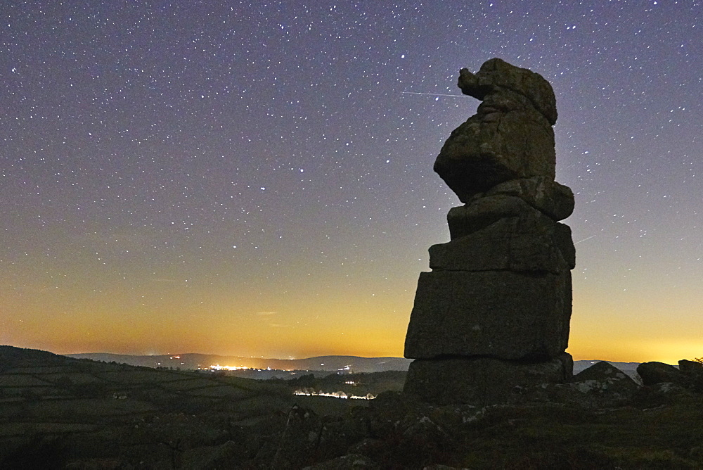 An odd natural granite outcrop against a clear night sky, Bowerman's Nose, Dartmoor National Park, Devon, England, United Kingdom, Europe