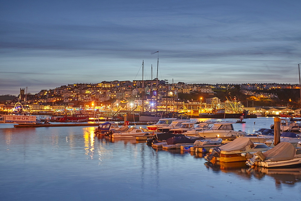 A dusk view of the fishing harbour at Brixham, the south coast's busiest fishing port, in Torbay, on the south coast of Devon, Brixham, Devon, England, United Kingdom, Europe