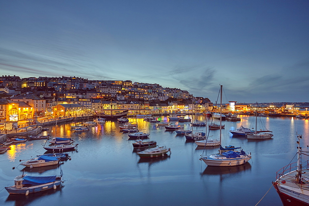 A dusk view of the fishing harbour at Brixham, the south coast's busiest fishing port, in Torbay, on the south coast of Devon, Brixham, Devon, England, United Kingdom, Europe