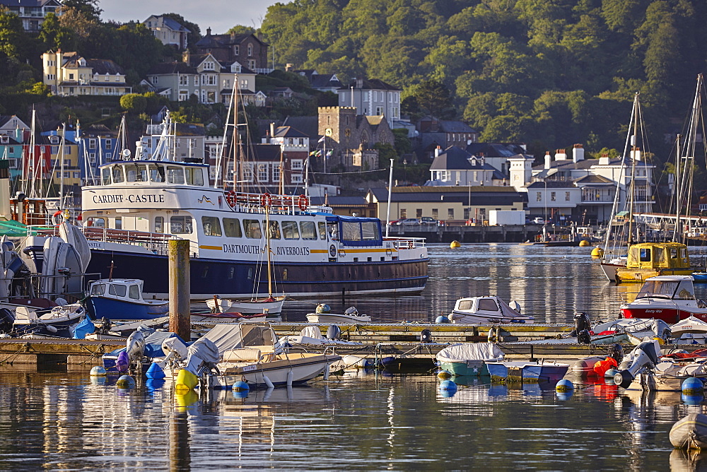 A crowd of boats moored in the harbour in the estuary of the River Dart, at Dartmouth, on the south coast of Devon, England, United Kingdom, Europe