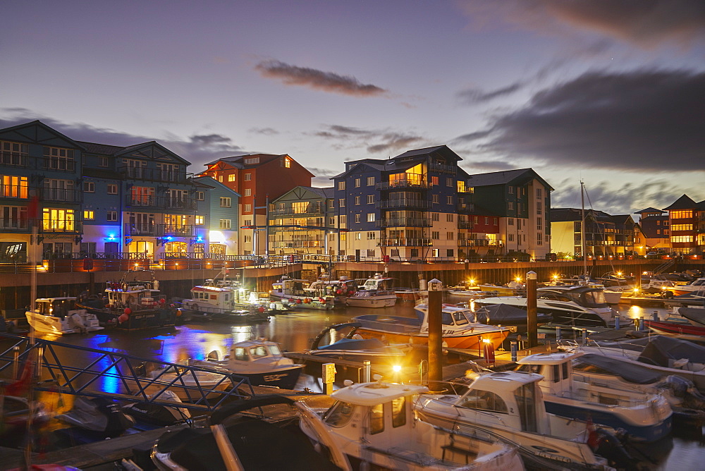 A dusk view of the marina and modern apartments in the revamped dock at Exmouth, on the south coast of Devon, England, United Kingdom, Europe