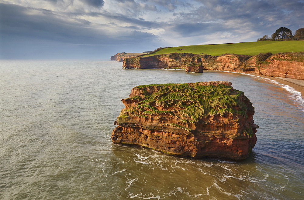 Red sandstone cliffs and rocks at Ladram Bay, in the Jurassic Coast UNESCO World Heritage Site, near Budleigh Salterton, East Devon, England, United Kingdom, Europe