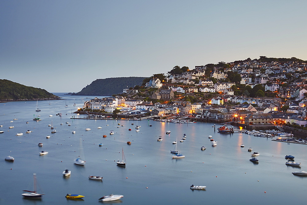 An atmospheric dusk view across the village of Salcombe and the Kingsbridge estuary, on Devon's south coast, Devon, England, United Kingdom, Europe