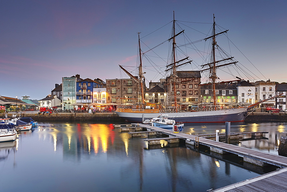 An atmospheric dusk at Sutton Harbour and the Barbican, the historic and tourism heart of the city of Plymouth, Devon, England, United Kingdom, Europe