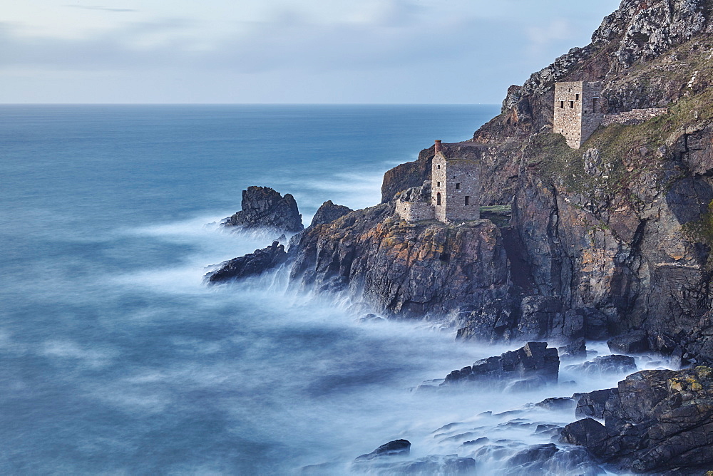 A dusk view of the iconic cliffside ruins of Botallack tin mine, UNESCO World Heritage Site, near St. Just, near Penzance, in west Cornwall, England, United Kingdom, Europe