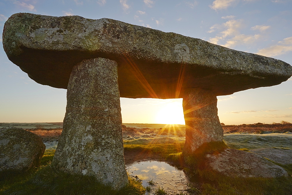 A sunrise view of the remains of a prehistoric burial chamber, known as Lanyon Quoit, near Penzance, west Cornwall, England, United Kingdom, Europe