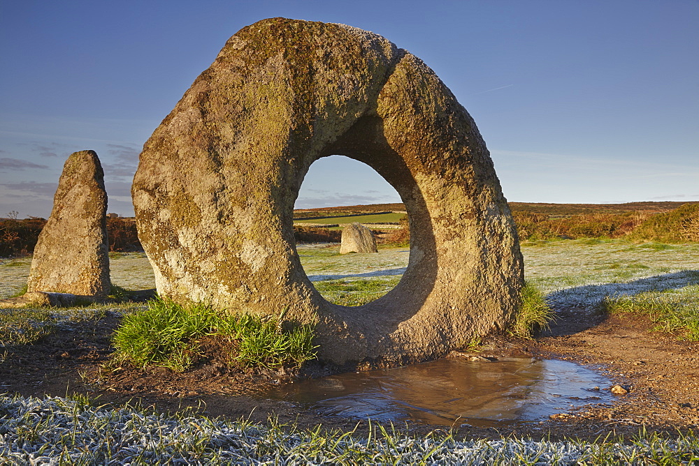 The mysterious prehistoric Men-an-Tol ring stone on a frosty morning, in a field near Penzance, in west Cornwall, England, United Kingdom, Europe