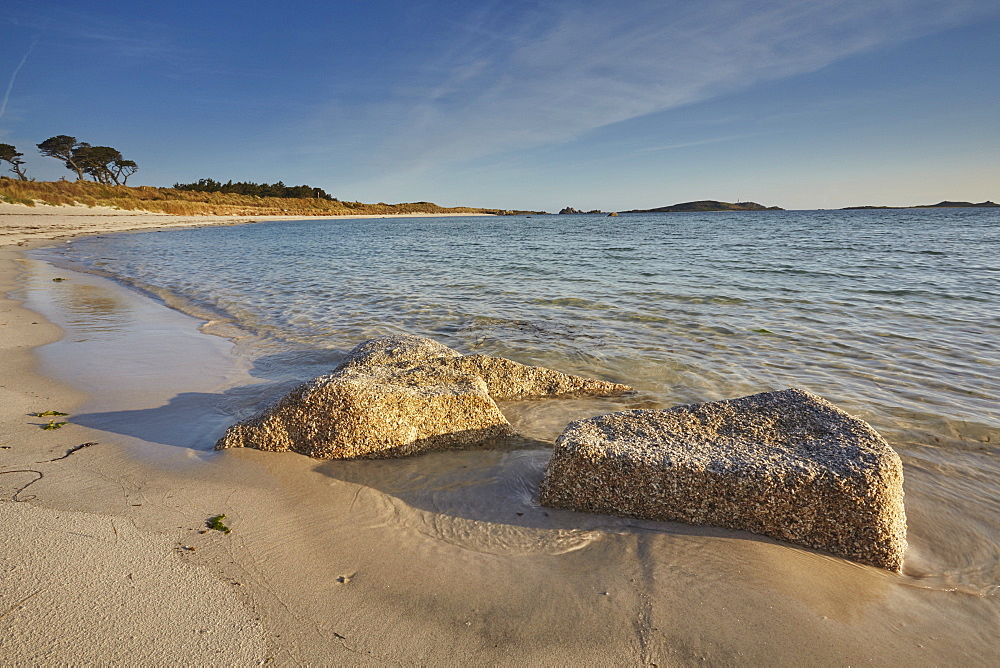 Granite boulders, a typical feature of the Isles of Scilly, seen along the shore in Pentle Bay, on the island of Tresco, Isles of Scilly, England, United Kingdom, Europe