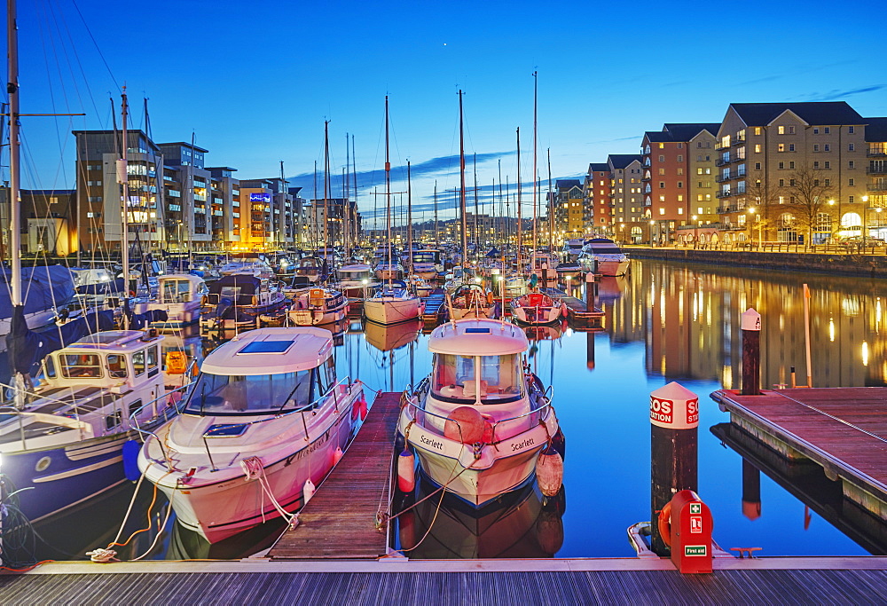 A dusk view of the modernised harbour and marina at Portishead, near Bristol, in Somerset, England, United Kingdom, Europe