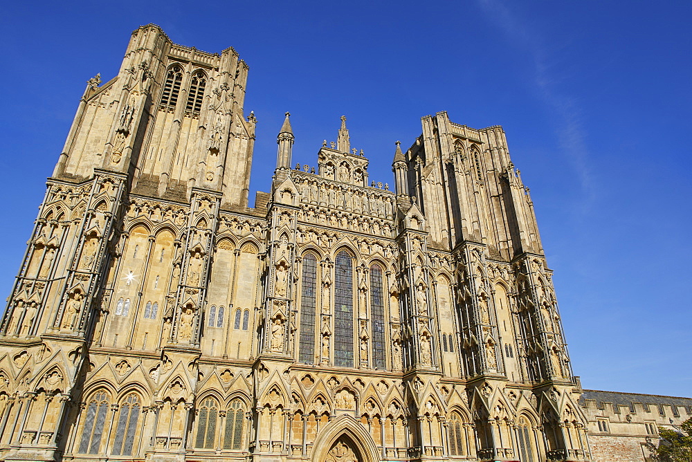 The historic western facade of Wells Cathedral, with its twin square towers, in Wells, Somerset, England, United Kingdom, Europe