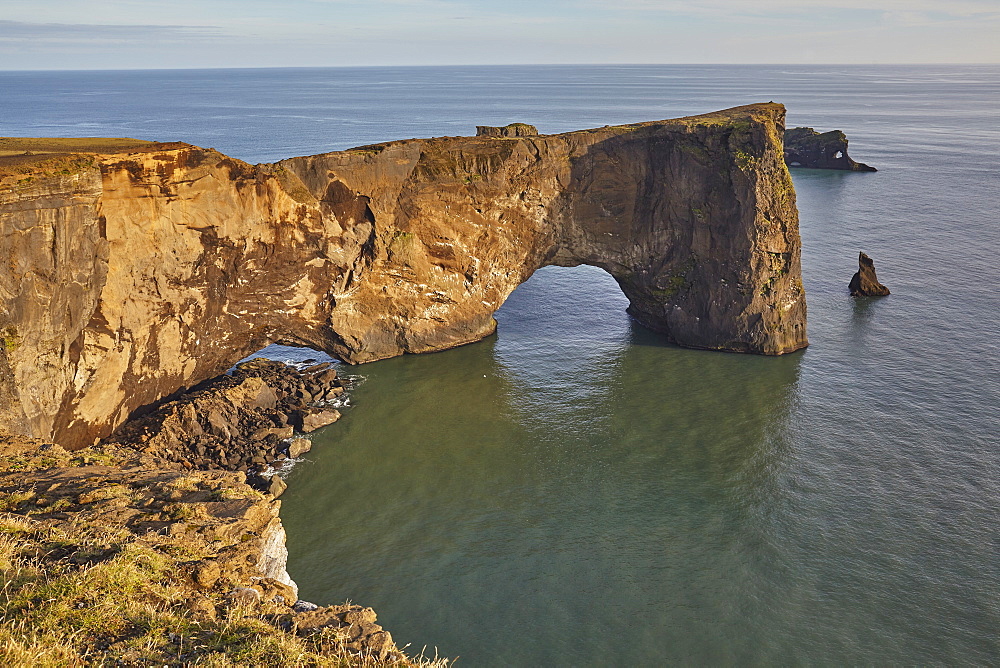 A rock arch on the southern shore of spectacular Dyrholaey Island, near Vik, on the south coast of Iceland, Polar Regions