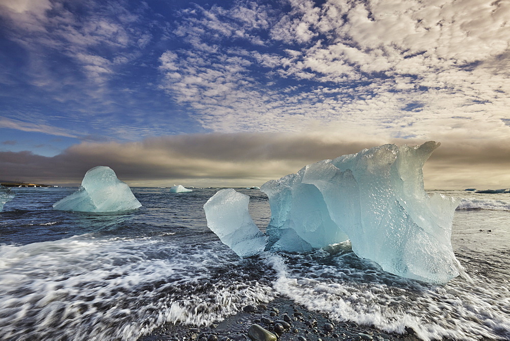 Melting glacial ice, carved from the Vatnajokull icecap, on the beach at Jokulsarlon, on the south coast of Iceland, Polar Regions