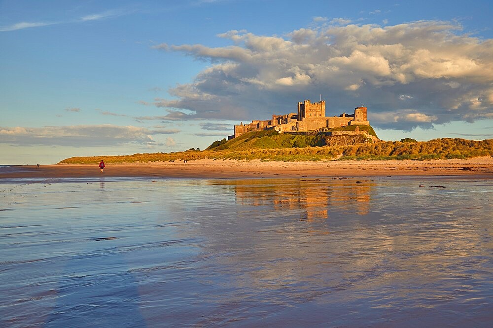 Bamburgh Castle and its beach, at Bamburgh, near Seahouses, Northumberland, England, United Kingdom, Europe