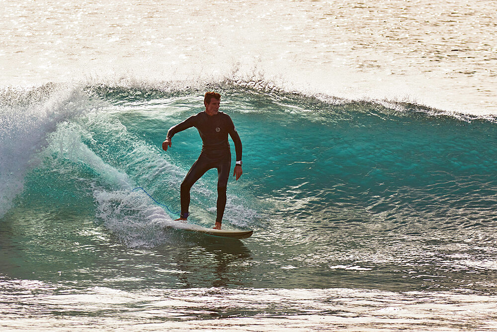 Surfing on Atlantic rollers at Ponta Preta, southwest coast of Sal, Cape Verde Islands, Atlantic, Africa