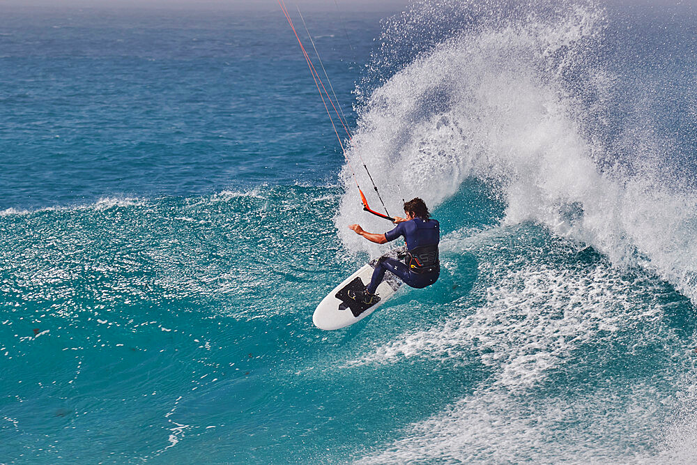 Kite-surfing on Atlantic rollers at Ponta Preta, southwest coast of Sal, Cape Verde Islands, Atlantic, Africa