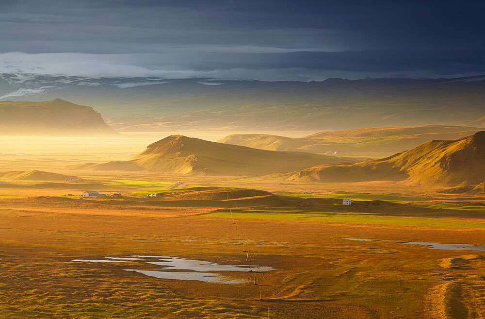 An inland view towards Mydralsjokull, seen from Dyrholaey Island, just before sunset, near Vik, southern Iceland, Polar Regions