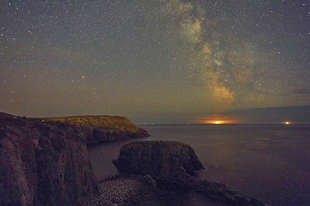 An autumn view of the Milky Way over the Atlantic Ocean, seen from the cliffs of Land's End, the most southwesterly point of Great Britain, Cornwall, England, United Kingdom, Europe