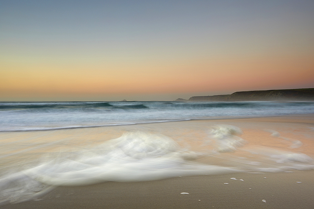 Atlantic shoreline at sunset, Whitesand Bay, Sennen Cove, near Land's End, in the far west of Cornwall, England, United Kingdom, Europe