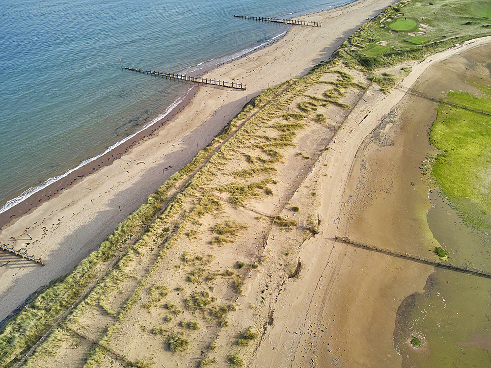 Aerial view of beach and dunes at Dawlish Warren, guarding the mouth of the River Exe, looking south along the coast towards the town of Dawlish, Devon, England, United Kingdom, Europe