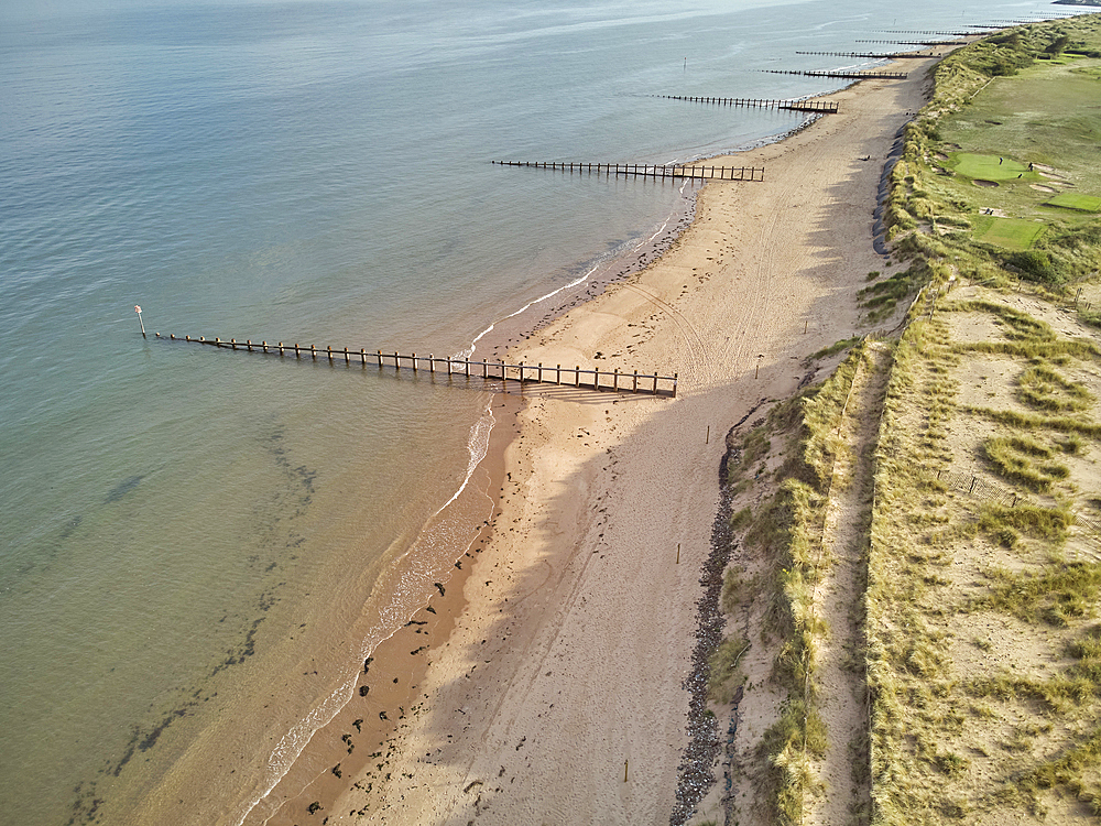 Aerial view of beach and dunes at Dawlish Warren, guarding the mouth of the River Exe, looking south along the coast towards the town of Dawlish, Devon, England, United Kingdom, Europe