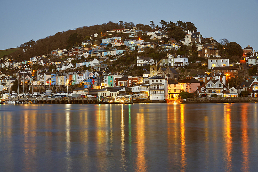 A dusk view of Kingswear, seen from Dartmouth, in the mouth of the River Dart, on the south coast of Devon, England, United Kingdom, Europe