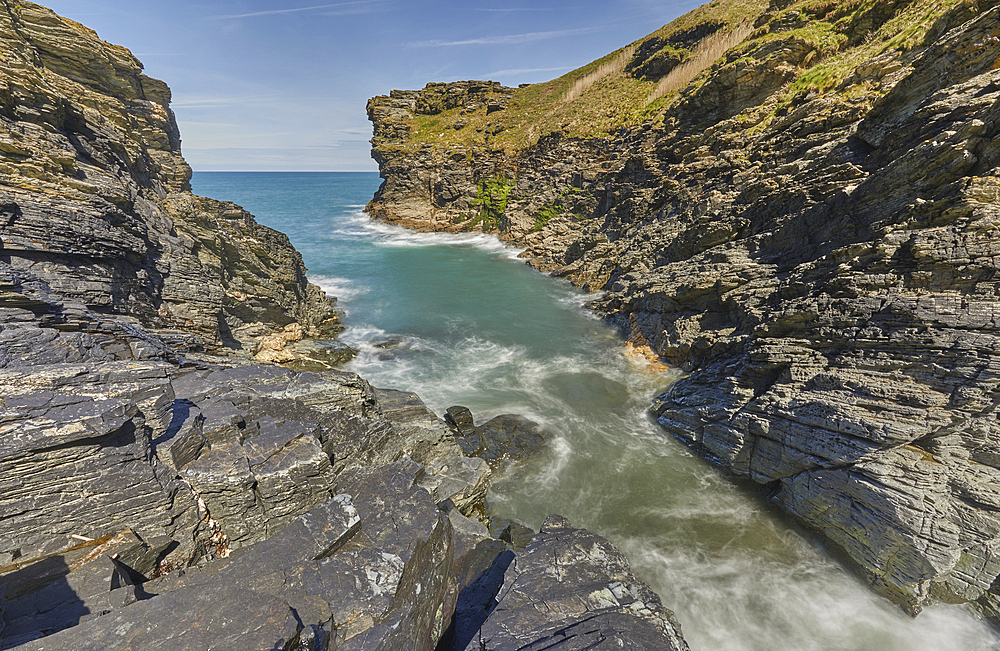 The beautiful cliff-lined cove that marks the end of Rocky Valley, on the Atlantic coast near the town of Tintagel, Cornwall, England, United Kingdom, Europe