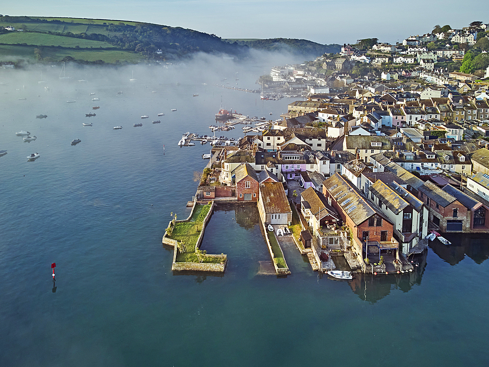 A misty early morning view of the town of Salcombe beside the Kingsbridge Estuary, Devon, England, United Kingdom, Europe