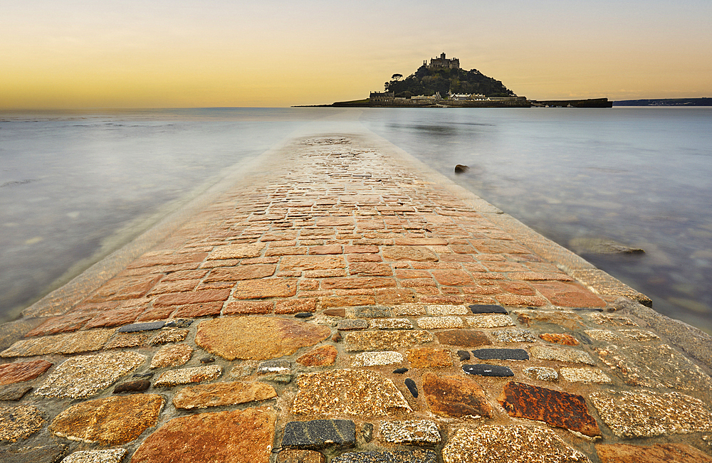 St. Michael's Mount in early morning light and a falling tide, with the causeway between the island and the mainland at Marazion still largely submerged, Marazion, near Penzance, Cornwall, England, United Kingdom, Europe