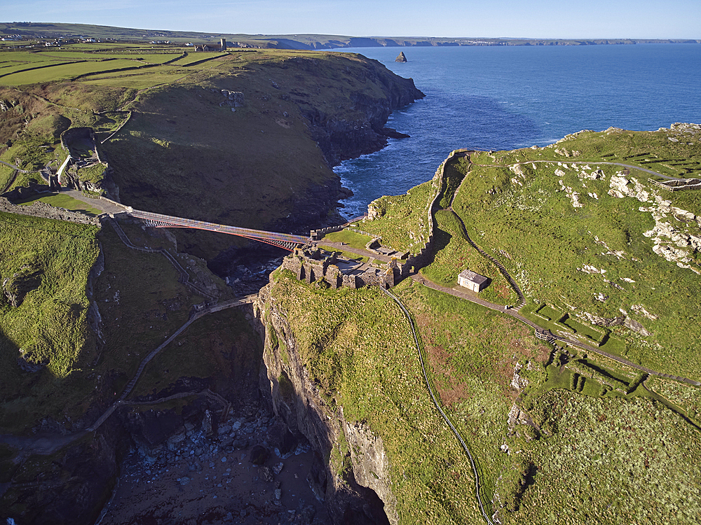 An aerial view of the dramatic ruins of Tintagel Castle, said to be the birthplace of King Arthur, on a rocky island off the shore, near the town of Tintagel, Cornwall, England, United Kingdom, Europe