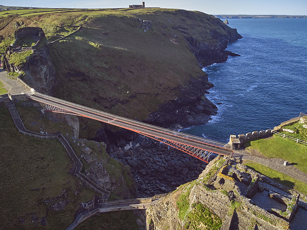 An aerial view of the dramatic ruins of Tintagel Castle, said to be the birthplace of King Arthur, on a rocky island off the shore, near the town of Tintagel, Cornwall, England, United Kingdom, Europe