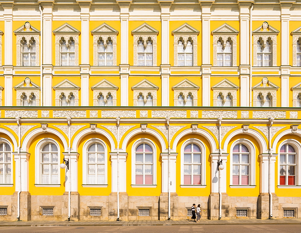 Two women walking in the Kremlin in front of Grand Kremlin Palace, UNESCO World Heritage Site, Moscow, Russia, Europe