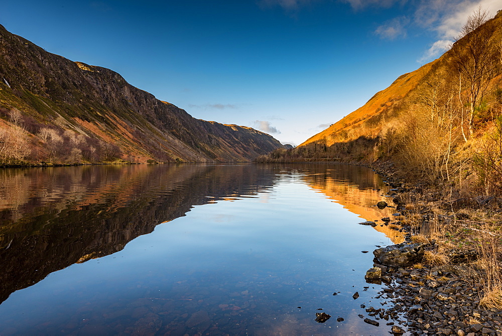 Early morning sunlight hits the waters of Loch Awe, Highlands, Scotland, United Kingdom, Europe