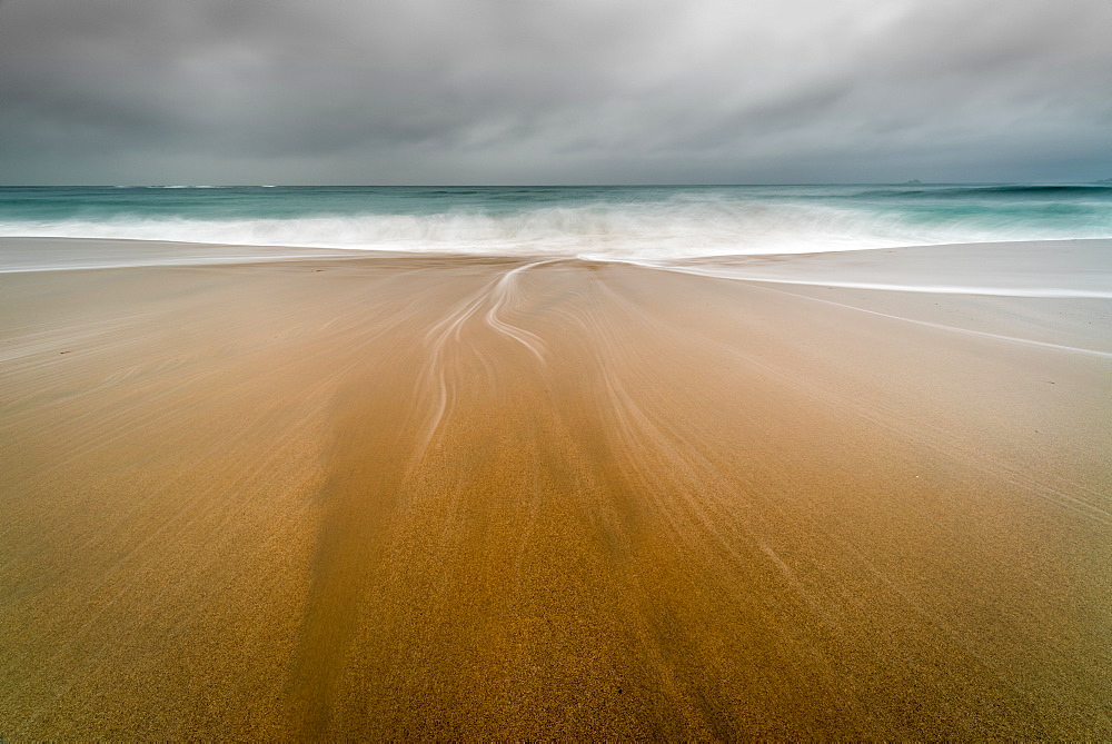 Water trails on Sennen Beach, with Brissons in far distance, Sennen, Cornwall, England, United Kingdom, Europe