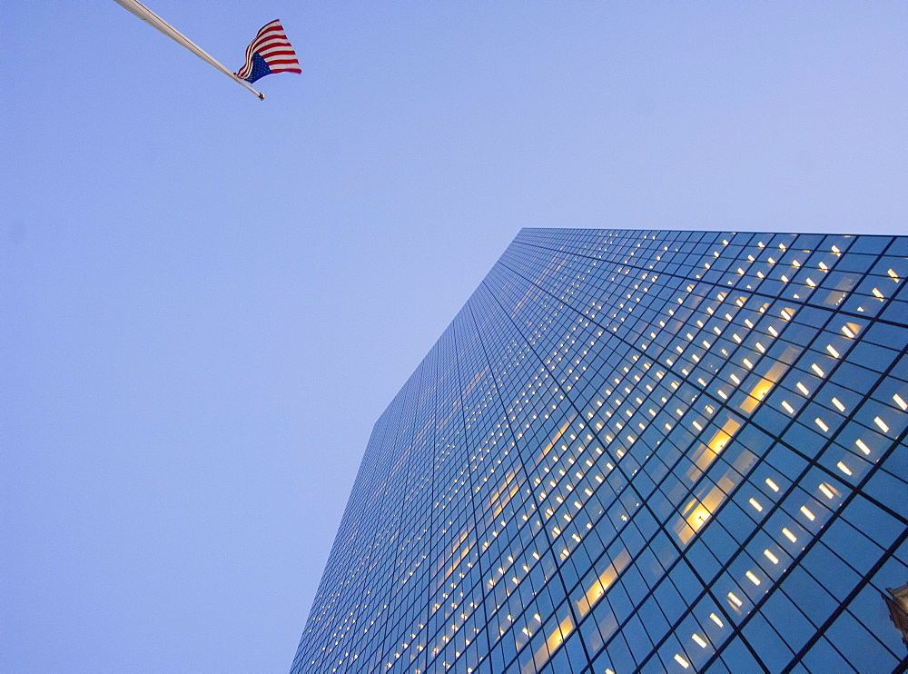 Looking up at Boston skyscraper and USA flag, Boston, Massachusetts, New England, United States of America, North America