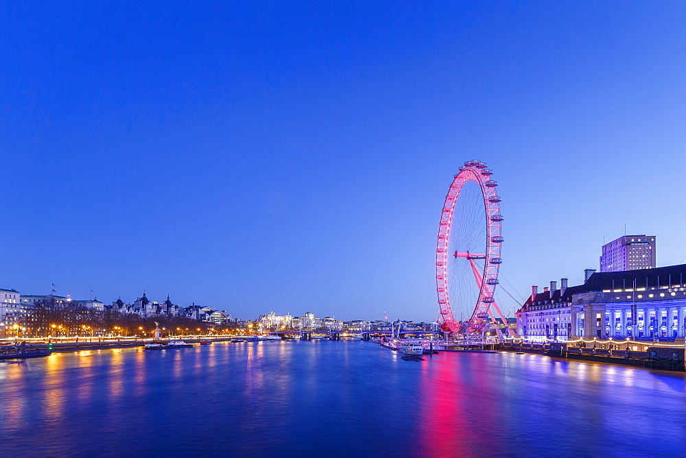 London Eye illuminated at night with view of the River Thames, London, England, United Kingdom, Europe