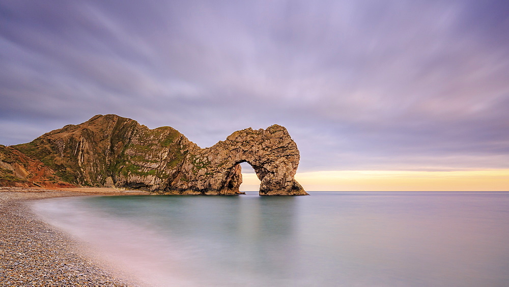 Dusk descends at Durdle Door on the Jurassic Coast, UNESCO World Heritage Site, Dorset, England, United Kingdom, Europe