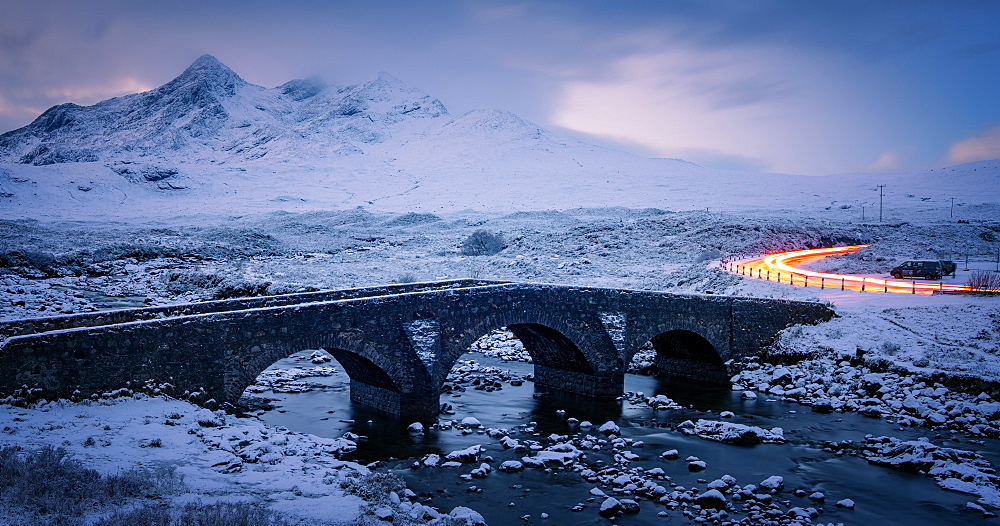 Sligachan Bridge in the snow with car light trails, Isle of Skye, Inner Hebrides, Scotland, United Kingdom, Europe