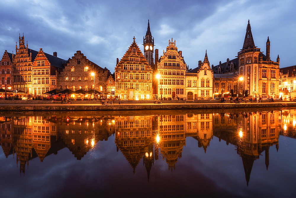 Graslei in the historic city of Ghent reflected in Leie river during blue hour, Ghent, East Flanders, Belgium, Europe