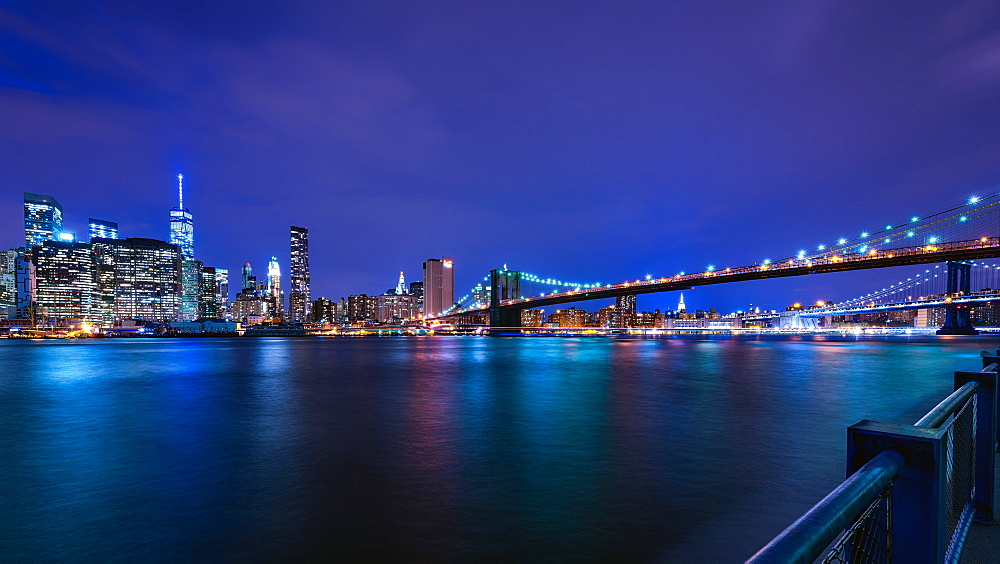 Brooklyn Bridge and Manhattan skyline at dusk, New York City, New York, United States of America, North America