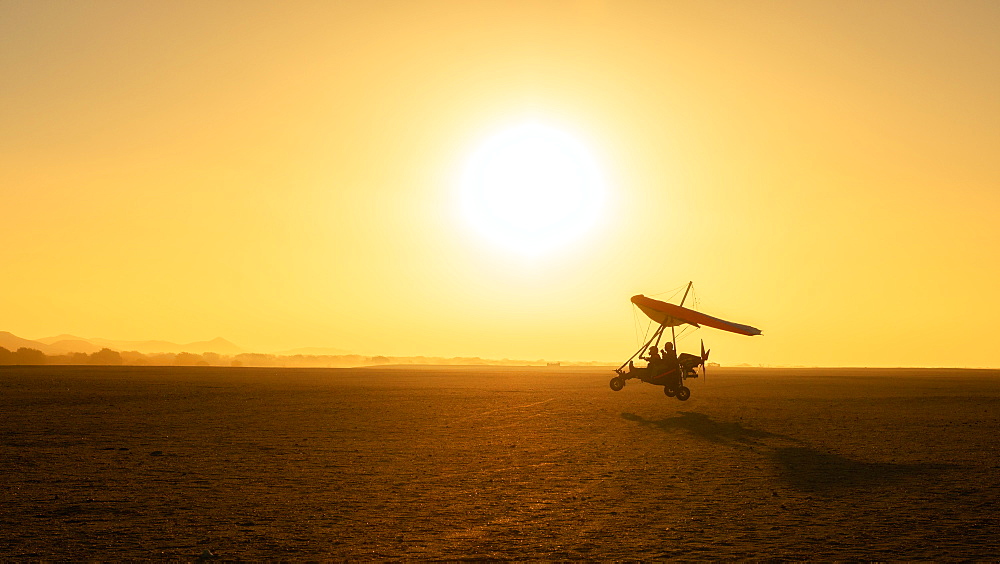 Micro-lighting over the sand dunes of the Namibian Desert, Namibia, Africa