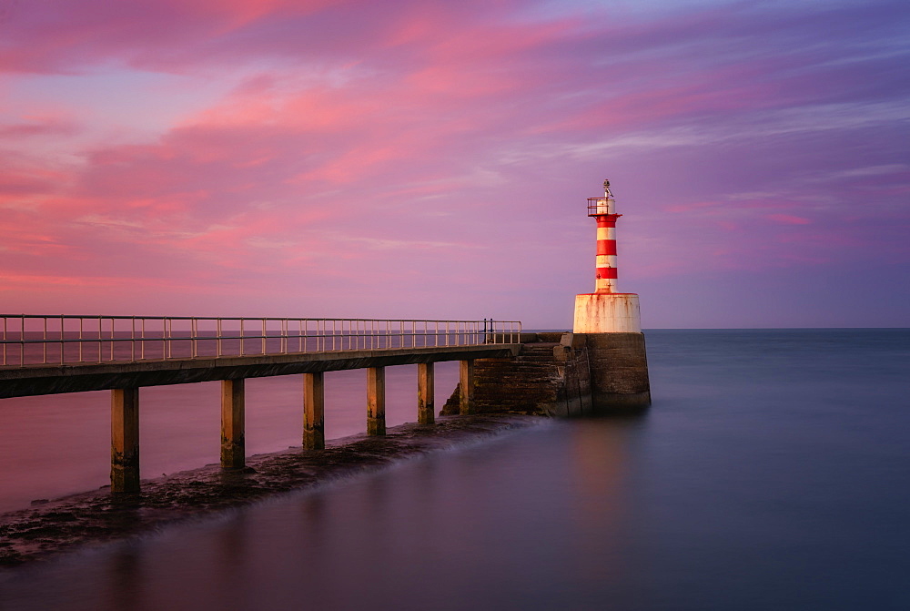 South Pier Lighthouse at sunset, Amble, Northumberland, England, United Kingdom, Europe