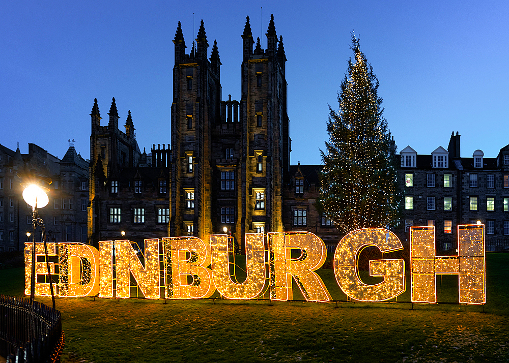 Edinburgh Christmas tree and sign in front of the New College, the Mound, Edinburgh, Scotland, UK