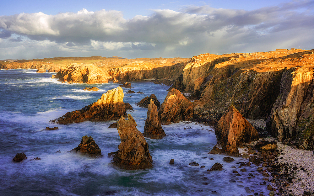 Mangersta Sea Stacks bathed in golden afternoon light, Isle of Lewis, Outer Hebrides, Scotland, United Kingdom, Europe