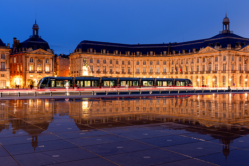 Tram at the Miroir D'Eau, Place de la Bourse at blue hour, Bordeaux, Gironde, Aquitaine, France, Europe