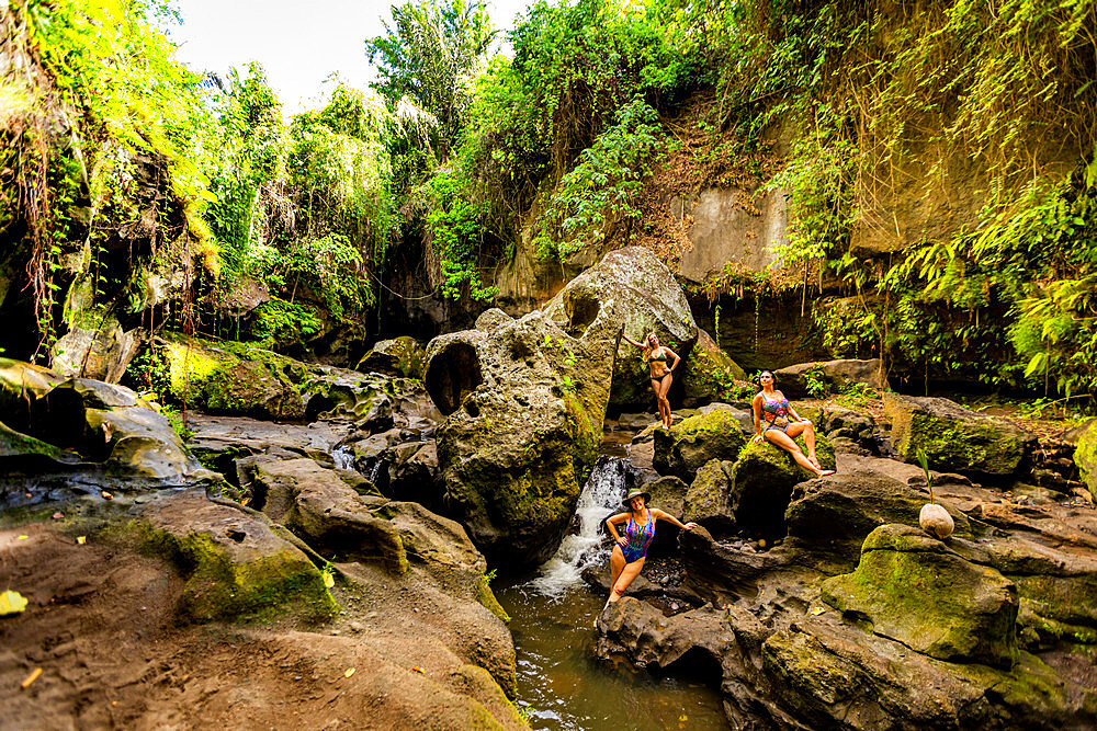 Women posing for a beautiful picture at the Beji Guwang Hidden Canyon, Bali, Indonesia, Southeast Asia, Asia