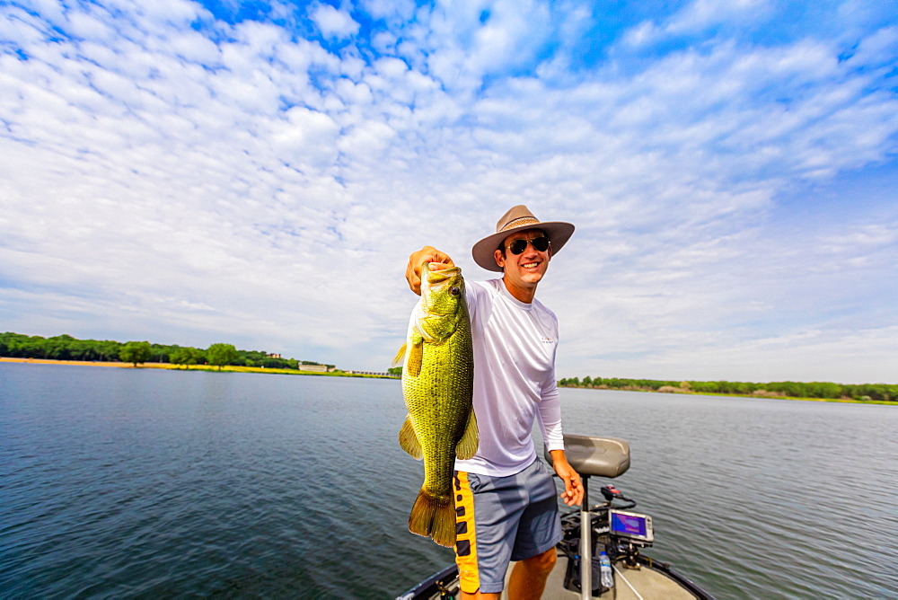 Man showing off his big catch of the day fishing on Yellowstone River, South Dakota, United States of America, North America