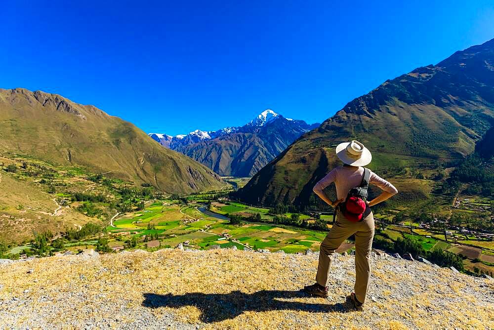 Woman exploring Inti Punku (Sun Gate), Cusco, Peru, South America