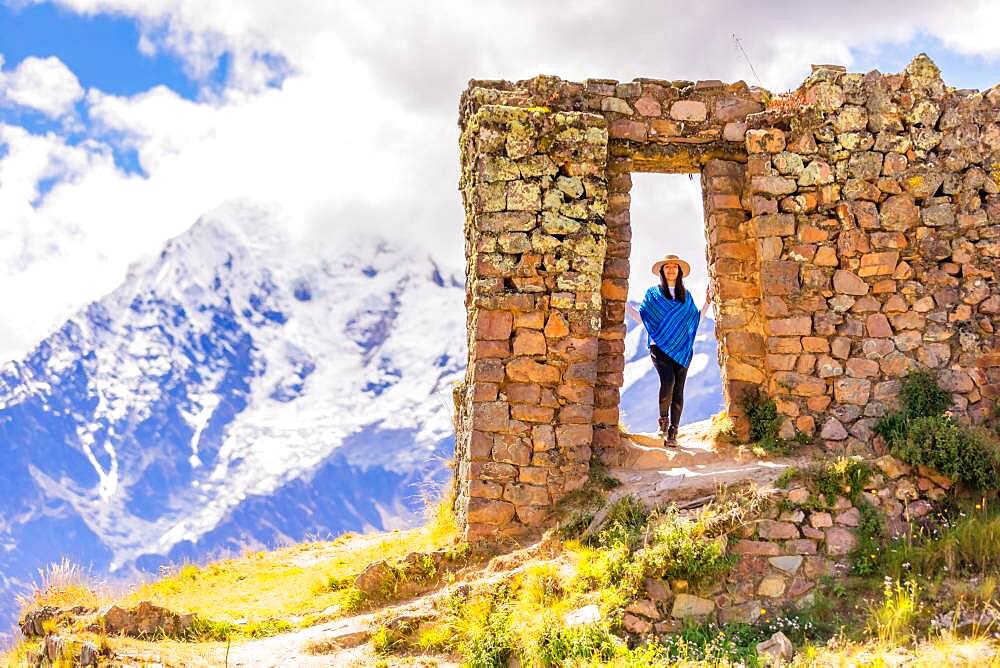 Woman exploring Inti Punku (Sun Gate), Cusco, Peru, South America